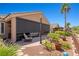 Outdoor patio with shade screens, comfortable seating, and landscaped surroundings at 1309 Vista Del Monte Dr, Mesquite, NV 89027