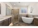 Contemporary bathroom featuring a standalone tub, tiled shower, and modern fixtures at 1309 Vista Del Monte Dr, Mesquite, NV 89027