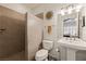 This bathroom features a step-in shower with beige tiling, a toilet, and a pedestal sink at 1309 Vista Del Monte Dr, Mesquite, NV 89027