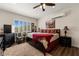 Comfortable bedroom features a ceiling fan, window shutters, and a plush rug at 1309 Vista Del Monte Dr, Mesquite, NV 89027