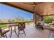 Covered patio with comfortable seating and a beautiful view of the desert landscape at 1309 Vista Del Monte Dr, Mesquite, NV 89027