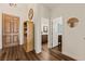 Bright entryway featuring beautiful wood floors, coat closet, and entry to bathroom at 1309 Vista Del Monte Dr, Mesquite, NV 89027