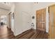 Bright entryway with wood floors, coat closet, and wood paneled front door at 1309 Vista Del Monte Dr, Mesquite, NV 89027