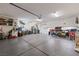 Large garage features an epoxy floor, overhead lighting, and lots of storage and work space at 1309 Vista Del Monte Dr, Mesquite, NV 89027