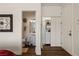 Hallway view to a bathroom with a pedestal sink and storage closet with built-ins at 1309 Vista Del Monte Dr, Mesquite, NV 89027