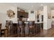 Open kitchen area with dark wood cabinets, breakfast bar, and modern appliances at 1309 Vista Del Monte Dr, Mesquite, NV 89027