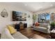 Open living room with patio access, stylish furniture, and natural light at 1309 Vista Del Monte Dr, Mesquite, NV 89027