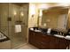 Bathroom features double sinks and a glass door shower at 145 E Harmon Ave # 27619, Las Vegas, NV 89109