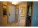 Comfortable interior hallway leading to the bathroom with bathtub and marble vanity at 145 E Harmon Ave # 27619, Las Vegas, NV 89109