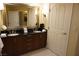 Double sink vanity with a large mirror in the bathroom at 145 E Harmon Ave # 27619, Las Vegas, NV 89109