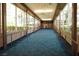 Bright hallway with large windows offering views of the surrounding greenery and landscaping at 145 E Harmon Ave # 27619, Las Vegas, NV 89109
