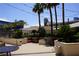 Outdoor lounge area with comfortable seating, lush landscaping, and shaded areas at 145 E Harmon Ave # 27619, Las Vegas, NV 89109