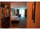 View of main bedroom with king bed, desk, and seating area at 145 E Harmon Ave # 27619, Las Vegas, NV 89109
