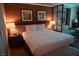 Spacious main bedroom with a king bed, seating area and bedside lamps at 145 E Harmon Ave # 27619, Las Vegas, NV 89109