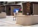 Outdoor pool area featuring cabanas with TVs, planters with palm trees, and lounge seating at 145 E Harmon Ave # 27619, Las Vegas, NV 89109