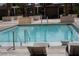 Outdoor pool area featuring a refreshing pool, palm trees, cabanas, and lounge chairs at 145 E Harmon Ave # 27619, Las Vegas, NV 89109