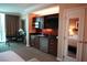 Wet bar with sink, refrigerator and microwave oven at 145 E Harmon Ave # 27619, Las Vegas, NV 89109