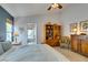 Bedroom with vaulted ceilings, tile floors, and views into the bathroom at 1632 Royal Canyon Dr, Las Vegas, NV 89128