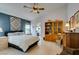 Bedroom with tile floors, blue accent wall, and wood furnishings at 1632 Royal Canyon Dr, Las Vegas, NV 89128