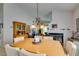 Open dining room featuring neutral walls, a chandelier, and seating for six at 1632 Royal Canyon Dr, Las Vegas, NV 89128