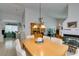 Dining room that opens to an office area, with neutral walls and tile floors at 1632 Royal Canyon Dr, Las Vegas, NV 89128