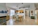 Comfortable dining room with modern lighting, leading into the kitchen at 1632 Royal Canyon Dr, Las Vegas, NV 89128