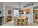 Bright dining area with pendant lighting and views into the kitchen at 1632 Royal Canyon Dr, Las Vegas, NV 89128