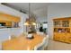 Elegant dining area featuring a stylish light fixture and access to office at 1632 Royal Canyon Dr, Las Vegas, NV 89128