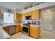 Well-lit kitchen featuring stainless appliances and tile countertops at 1632 Royal Canyon Dr, Las Vegas, NV 89128
