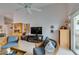 Spacious living room with tile flooring and sliding door access to the outside at 1632 Royal Canyon Dr, Las Vegas, NV 89128