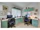 Bright, open office space featuring built in shelves and two desks for comfortable working at 1632 Royal Canyon Dr, Las Vegas, NV 89128