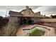 Backyard featuring a covered patio, in-ground pool, and desert landscaping at 1749 Green Apple Way, Las Vegas, NV 89142