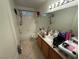 Bathroom featuring a shower over bath, tile flooring, and a single vanity at 1749 Green Apple Way, Las Vegas, NV 89142