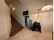 Bright foyer with tile flooring, staircase, and decorative chandelier at 1749 Green Apple Way, Las Vegas, NV 89142