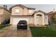 Charming two-story home featuring a two-car garage and well-maintained front yard at 1749 Green Apple Way, Las Vegas, NV 89142