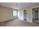 A clean bedroom boasts carpet flooring, neutral walls, and a doorway leading to an adjacent closet at 240 N 19Th St, Las Vegas, NV 89101