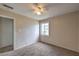 Cozy bedroom featuring neutral walls, ceiling fan and natural light from the window at 240 N 19Th St, Las Vegas, NV 89101