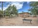 Backyard view featuring a single-story home, large yard and mature trees at 240 N 19Th St, Las Vegas, NV 89101