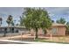 Street view of a single story home with mature trees in front yard at 240 N 19Th St, Las Vegas, NV 89101