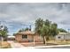 Single story home with small front yard and a fenced drive way at 240 N 19Th St, Las Vegas, NV 89101