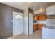 Kitchen with tile floors, wood cabinets, and white appliances at 240 N 19Th St, Las Vegas, NV 89101