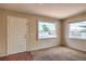 Living room with large windows, neutral paint, carpet and hardwood floors at 240 N 19Th St, Las Vegas, NV 89101