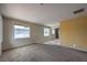 Large living room with carpeted and hardwood floors, windows, and neutral walls at 240 N 19Th St, Las Vegas, NV 89101