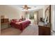 Cozy bedroom with neutral walls, carpet, and a window providing natural light and a view of the outdoors at 2467 Moonlight Valley Ave, Henderson, NV 89044