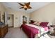 Spacious bedroom featuring a ceiling fan, connected bathroom, and a vanity at 2467 Moonlight Valley Ave, Henderson, NV 89044