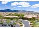 Aerial view of community clubhouse highlighting architecture, parking, and landscaping at 2467 Moonlight Valley Ave, Henderson, NV 89044