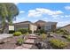 Charming single-story home featuring stone accents, a landscaped front yard, and a welcoming walkway at 2467 Moonlight Valley Ave, Henderson, NV 89044
