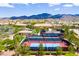 Overhead view of the community tennis courts, with views of the clubhouse and the surrounding community at 2467 Moonlight Valley Ave, Henderson, NV 89044