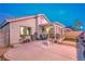 Backyard showcasing a covered patio, BBQ, block wall and landscaped area, ideal for outdoor enjoyment at 2595 Amber Crest St, Las Vegas, NV 89142