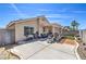 Backyard showing the house's exterior, an open patio, a grill, and a block wall at 2595 Amber Crest St, Las Vegas, NV 89142